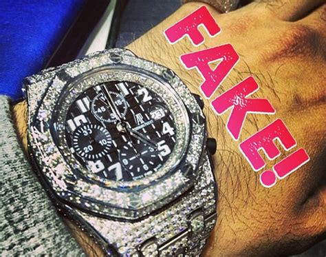 rappers with fake watches|rappers wearing diamond rings.